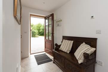 This is the entrance hall with a useful settle for taking off your walking boots after a day out exploring the Mendip Hills.