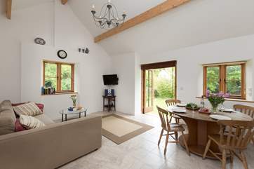 The Barn has a spacious open plan living area, with the kitchen in one corner and a large dining table in case you have guests to visit for a meal.