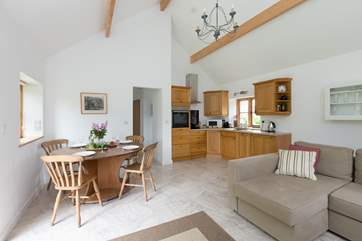 Another view of the open plan layout, the high ceilings and French windows mean that there is plenty of light.