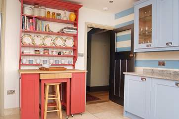 The kitchen leads to the hallway.