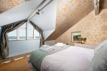 The second ensuite bedroom on the first floor houses a double bed.