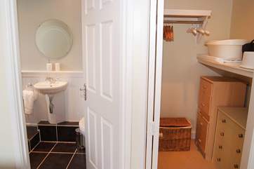 With a walk-in closet next to the en suite bathroom...