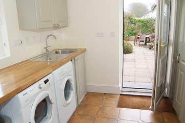 The utility-room and shower-room next door are perfect for washing off after a day on the beach.