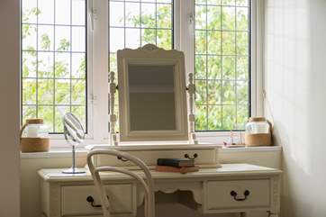 Getting ready for your day or night out is a real pleasure in this lovely bedroom.