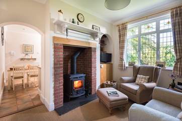 The snug offers a sanctuary to relax and maybe read a book in front of the wood-burner.