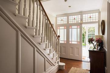 This fabulous house retains many original features including the gorgeous glass entrance porch.