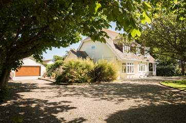 There are two entrances to the driveway and lots of space for parking in front and beside the house.