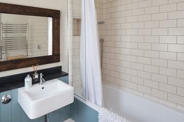 The ground floor bathroom is opposite bedroom 1.