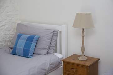 One of the single beds in bedroom 3.