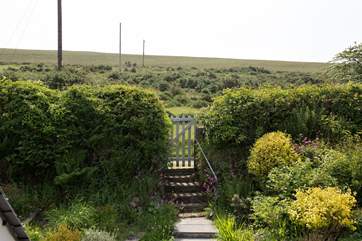A small gate leads up on to the moor.