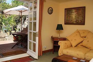 French doors open onto the sunny enclosed terrace.