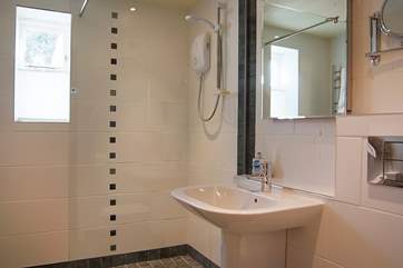 The wet-room has a large walk-in shower.