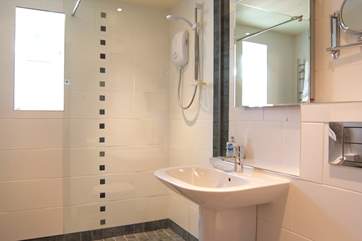 The wet-room has a large walk-in shower.