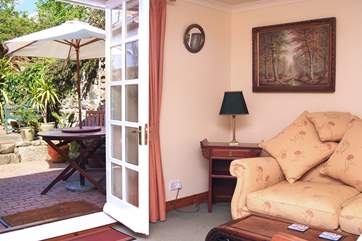 French doors open onto the sunny enclosed terrace.