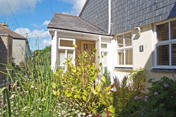 The cottage also has an enclosed front courtyard.