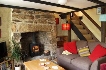 Enter the cottage into the comfortable sitting-room that retains many original features alongside stylish modern furnishings and although cosy, the head height is just over six feet.