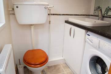 The utility-room by the back door also houses an additional WC.