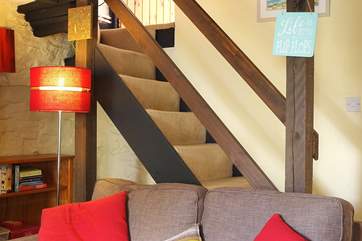 The traditional cottage staircase is a little steep with a low lintel on the way up and divides at the top step to the bedrooms.