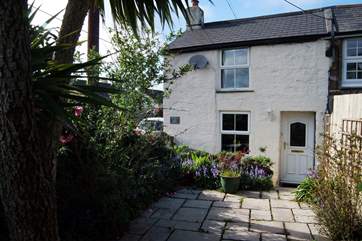 Located in the heart of this bustling village, the name of this lovely cottage translates to Little Rose Cottage.