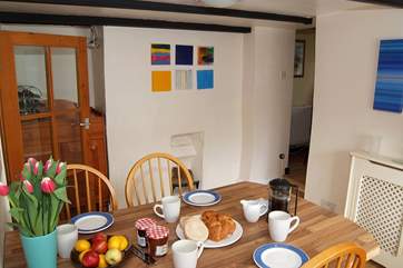 The dining-room links the sitting-room with the kitchen and rear patio garden.