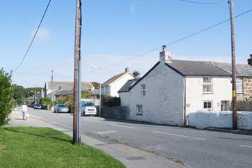 This cute cottage sits on the roadside in the heart of Illogan, there is a 30mph limit on the road and the traffic tends to be local.