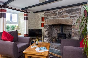 Snuggle together on the sofa in front of the fire.