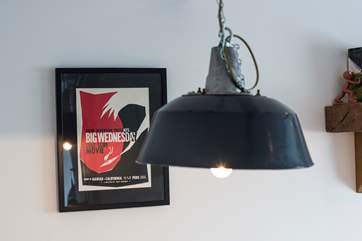 Retro lamps and posters add charm.