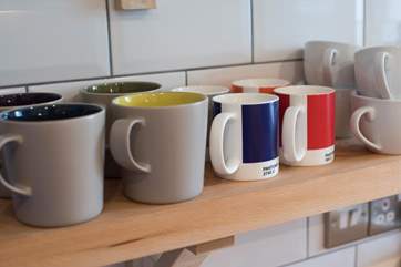 Colourful mugs in the kitchen.