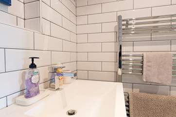A heated towel rail to keep the shower-room warm.