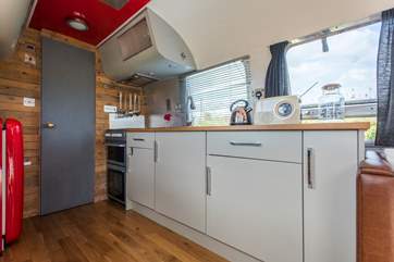 There is an electric cooker and microwave - perfect for rustling up a scrumptious supper.
