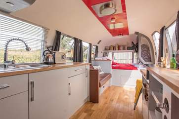 Looking past the kitchen to the bedroom area.