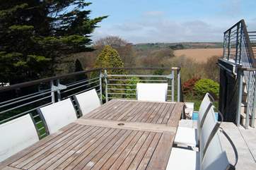 The dining-area on the decked balcony outside the kitchen.