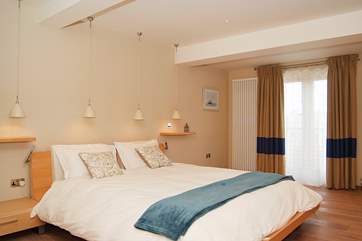 Bedroom 2 on the lower ground floor is very spacious and has a 6' double bed and doors out to the terrace.