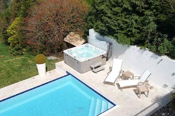 Looking down at the pool and hot tub from the living-room balcony.