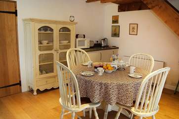 The kitchen is a light space with room enough to eat together.
