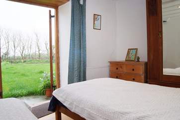 The twin bedroom has doors opening onto the garden (these can be locked if children are using this room).