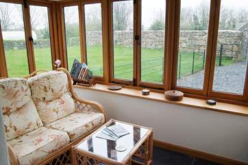The oak-framed conservatory has great garden views.