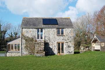 Pretty Chough Cottage is detached and surrounded by gardens.