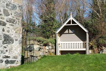 The wooden arbour is the perfect place to sit and read a book or simply take in the nature around you.