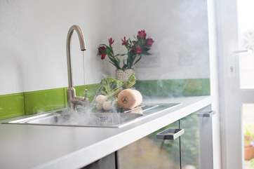 Prepare a meal in the well-equipped kitchen.