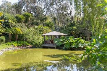 The pergola is a lovely place to sit on a hot day.