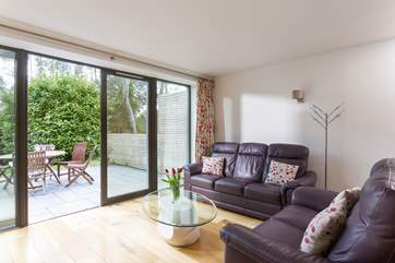 Full-height doors open from the living-room out to the terrace.