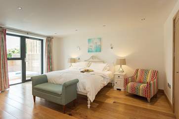 The beautiful bedroom has a 6' carved Provencal bedstead.