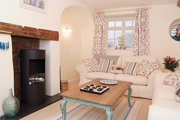The living-room is a good size, plenty of space for you all to relax in comfort. There is now an electric wood-burner effect stove for those out of season evenings.