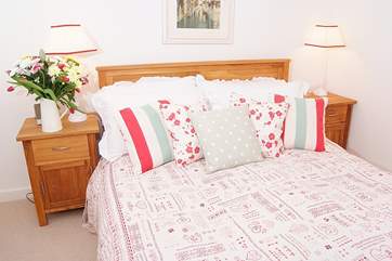 The double bedroom has a view over the shared cobbled courtyard.