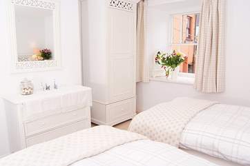 The twin bedroom looks out over the top end of the courtyard.