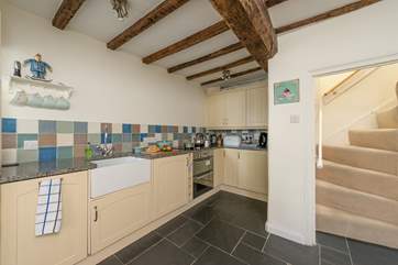 The kitchen fits perfectly along the wall of the open plan kitchen/dining room. The stairs are steep but there are handrails all the way up.