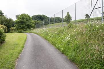 The driveway up to Sturthill Stable, overlooked by the tennis court.