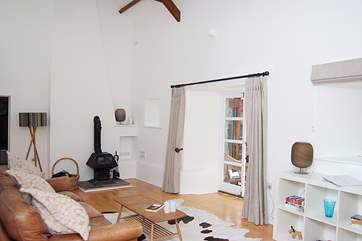 The ceiling in the sitting-room is very high, you can catch a glimpse of one of the exposed beams in the photograph.