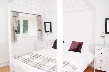 The cool white double bedroom.